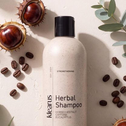 Klearus Strengthening herbal shampoo flat-lay with horse chestnuts, coffee beans and eucalyptus